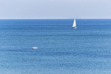 sailboat in the sea. luxury yachting in a calm water. for marine and navigation conceptの写真素材