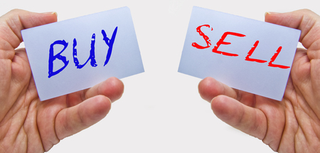 business man hands holding cards with buy sell wordsの写真素材