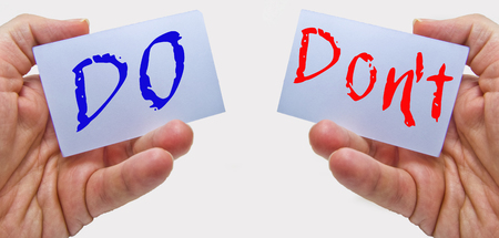 do and don't words hold on business man hands for teamwork conceptの写真素材