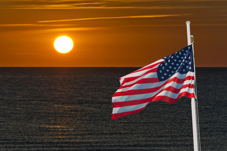 sunrise with usa flag in a summer day for july 4thの写真素材
