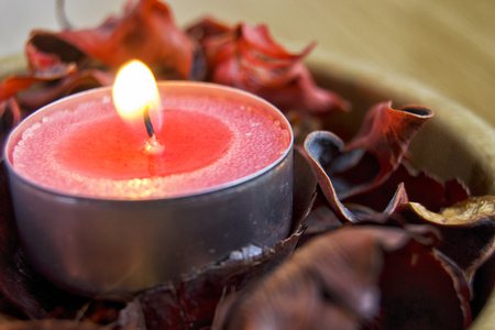 pink candle light with potpourri for spa and christmas decoration conceptの写真素材