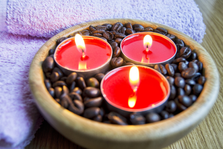 candle lights with coffe beans for spa and christmas decoration concept.の写真素材
