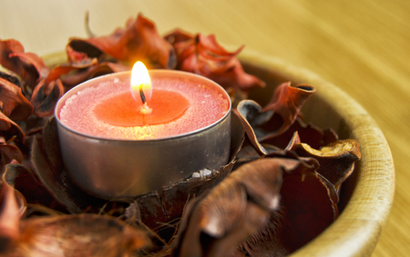 pink candle light with potpourri for spa and christmas decoration conceptの写真素材