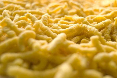 Passatelli pasta. Traditional delicious food of Modena, Emilia Romagna, Italy. Made with: eggs, bread crumbs, parmesan cheese, flour, nutmegの写真素材