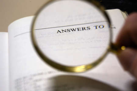 magnifying glass analyzing the word answers