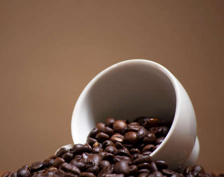 cofee beans in a white ceramic cup. concept for food and beverage, relaxing time, wellnessの写真素材