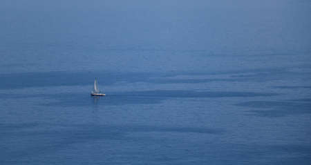 View on one yacht sailing in blue ripple water.の写真素材