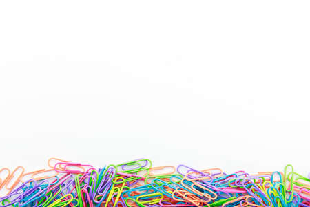Colorful paperclips on white background