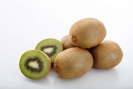 Kiwis stacked on white backgroundの写真素材