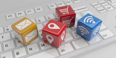 3d rendering cubes, tech symbols on a white keyboardの写真素材