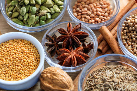 Srar anise and other spices on a wooden surfaceの写真素材