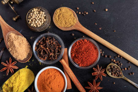 Variety of colorful spices, black backgroundの写真素材