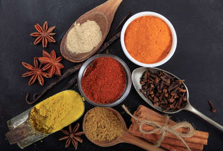 Variety of colorful spices, black backgroundの写真素材
