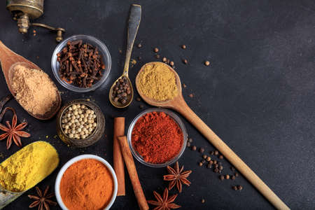 Variety of colorful spices, black backgroundの写真素材