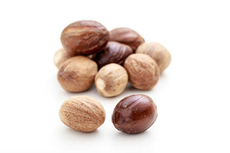 Nutmeg seeds on white backgroundの写真素材