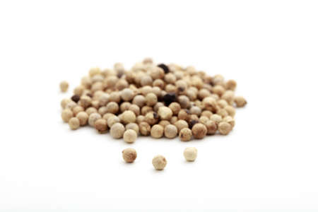 White pepper seeds on white backgroundの写真素材