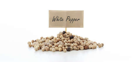 White pepper seeds on white backgroundの写真素材