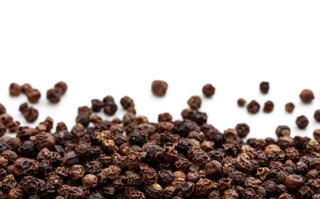 Black pepper seeds on white backgroundの写真素材