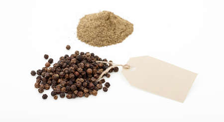 Black pepper seeds on white backgroundの写真素材
