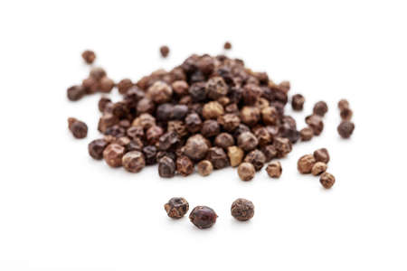Black pepper seeds on white backgroundの写真素材