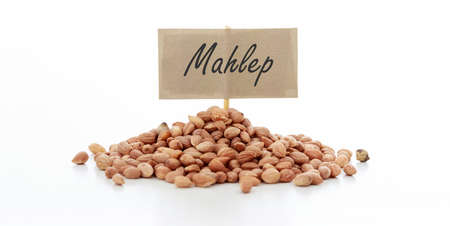 Mahlab seeds with a label on a white backgroundの写真素材
