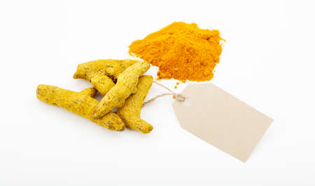 Turmeric seeds with a label on a white backgroundの写真素材