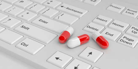 3d rendering red white pills on white keyboardの写真素材