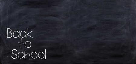 3d rendering Back to school written on a black chalkboardの写真素材