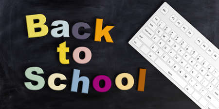 3d rendering Back to school and a keyboard on a black chalkboardの写真素材