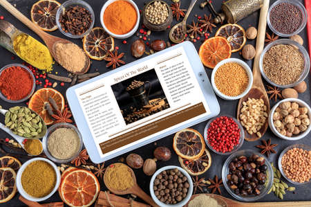 Composition of spices and a tablet with a recipeの写真素材