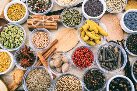 Composition of various spices on a wooden surfaceの写真素材