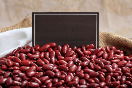 Kidney beans in a sack with a black labelの写真素材