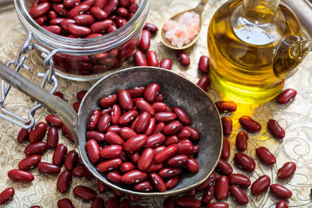 Raw red beans background and a metallic ladleの写真素材