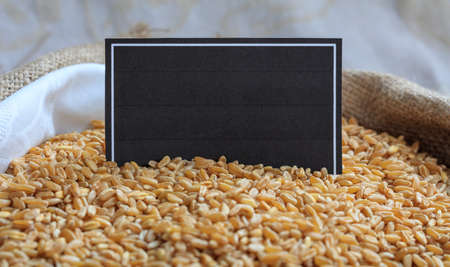 Wheat seeds in a sack with a labelの写真素材