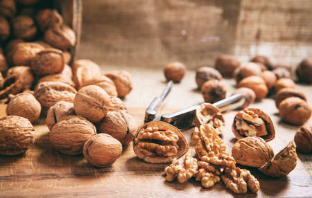 Walnuts and an old nutcracker on a table