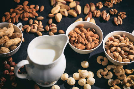 Milk from nuts on a black background