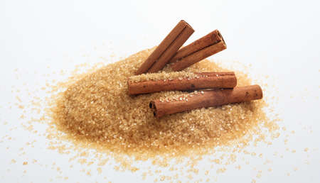 Brown sugar heap on white backgroundの写真素材