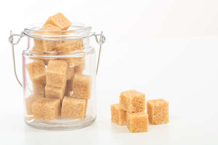 Brown sugar cubes on white backgroundの写真素材