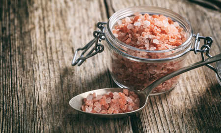 Pink Himalayan salt crystals on a tableの写真素材