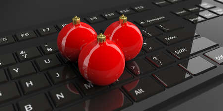 3d rendering christmas balls on a black keyboard