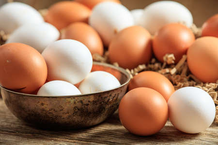 Brown eggs on a wooden surface