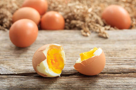 Brown eggs on a wooden surfaceの写真素材