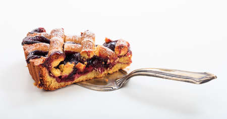 A slice of fruit tart on white backgroundの写真素材