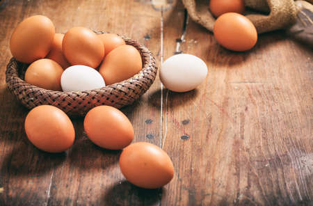 Fresh eggs on a wooden tableの写真素材