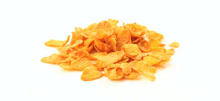 A heap of corn flakes on white backgroundの写真素材