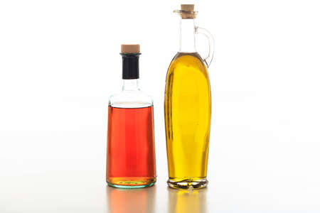 Olive oil and vinegar bottles on white backgroundの写真素材