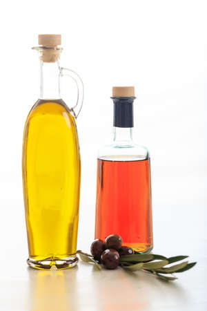 Olive oil and vinegar bottles on white backgroundの写真素材