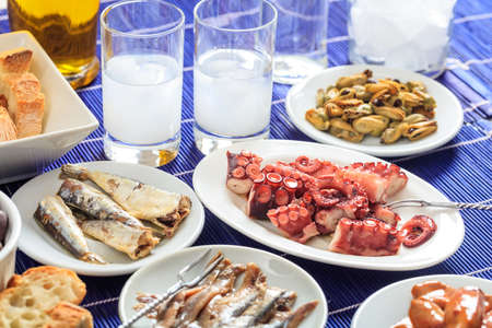 Glasses of ouzo and appetizersの写真素材