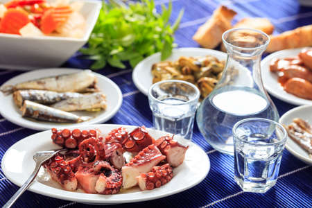 Glasses of ouzo and appetizersの写真素材