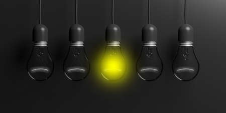 3d rendering light bulbs hanging on black backgroundの写真素材